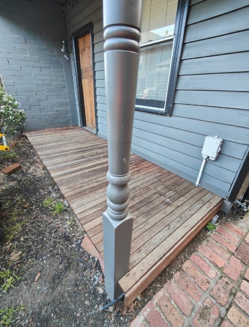 Weathered grey deck boards before restoration