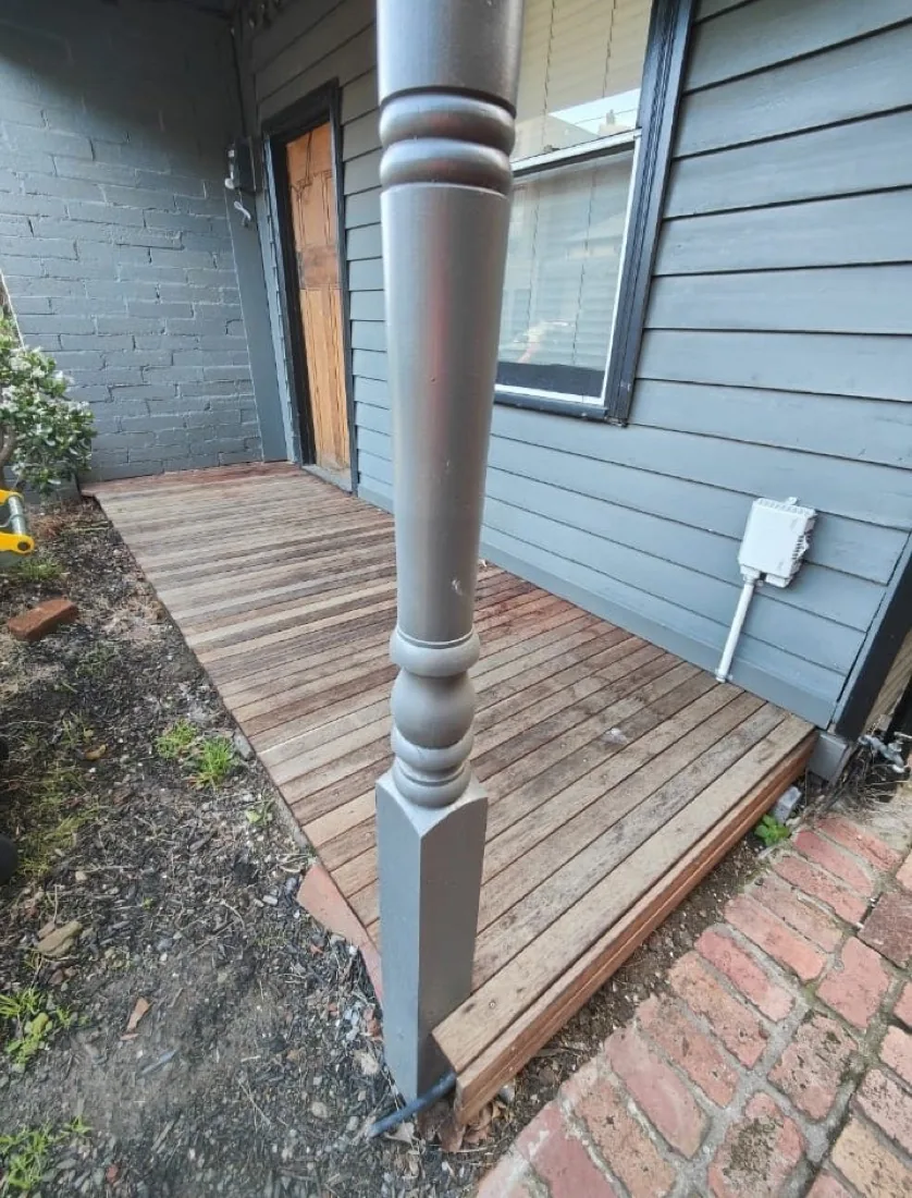Weathered grey deck boards before restoration